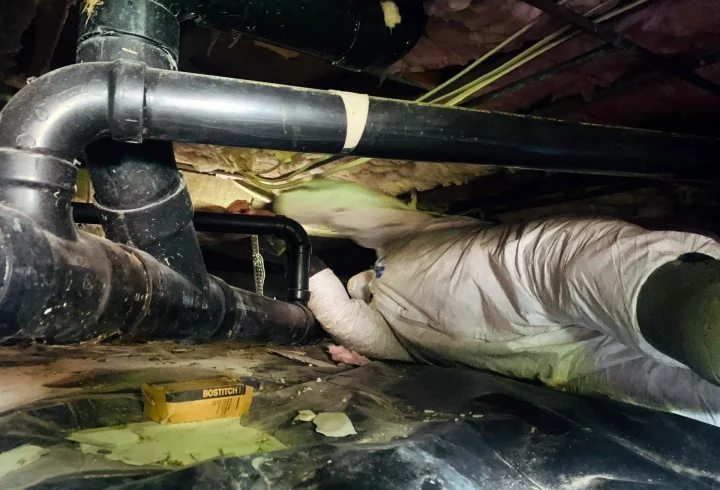PNW Construction and Energy Services expert inspects the crawl space insulation