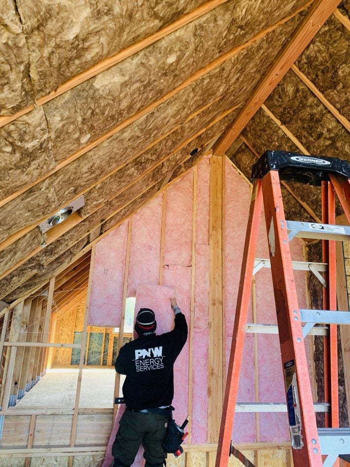 PNW Construction and Energy Services expert installs wall insulation