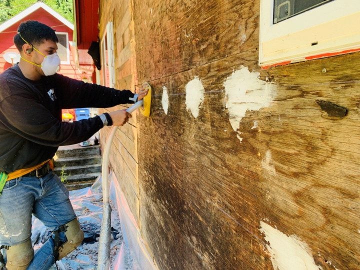 PNW Construction and Energy Services expert preps the wall for insulation