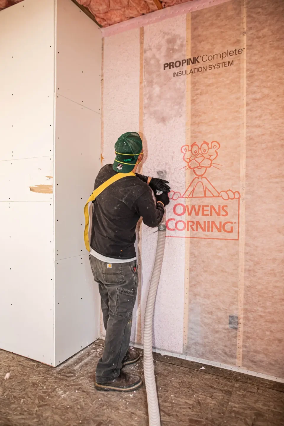 Washington Insulation installing cellulose insulation in a newly built home.